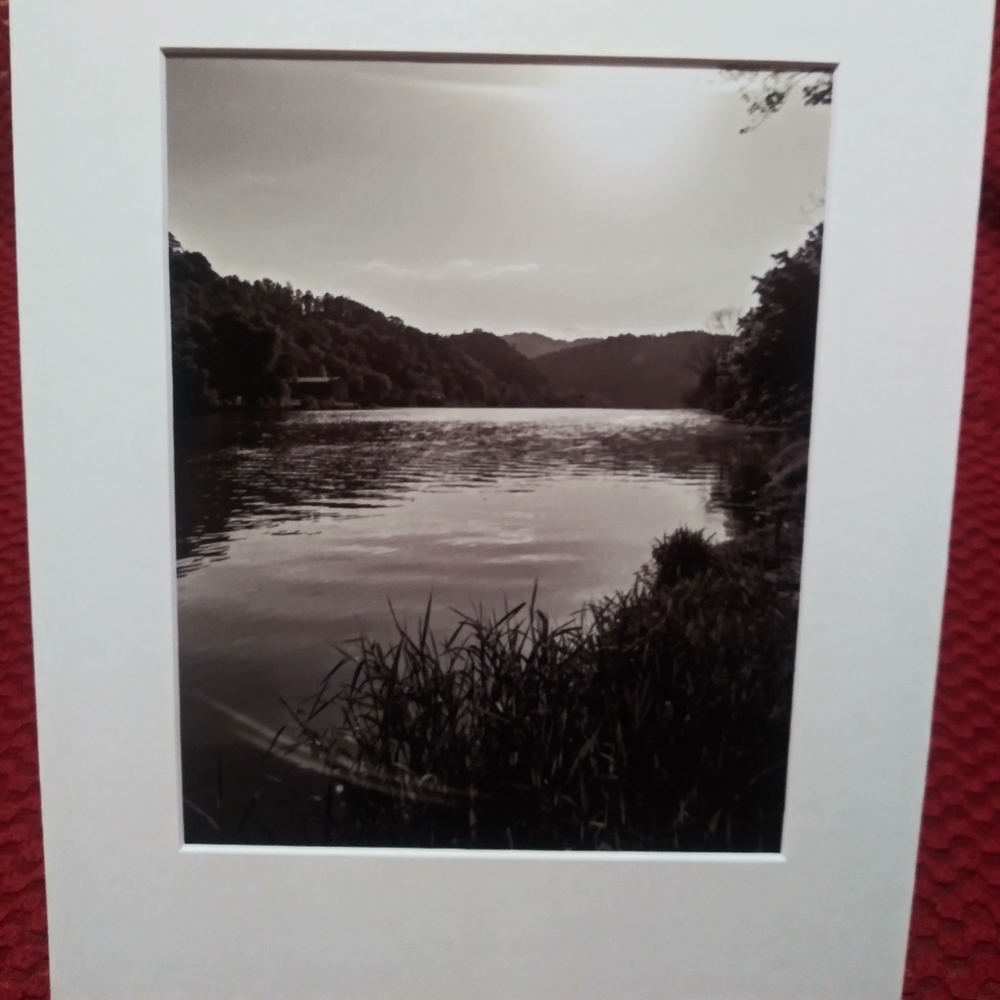 B&W Sun setting over still waters